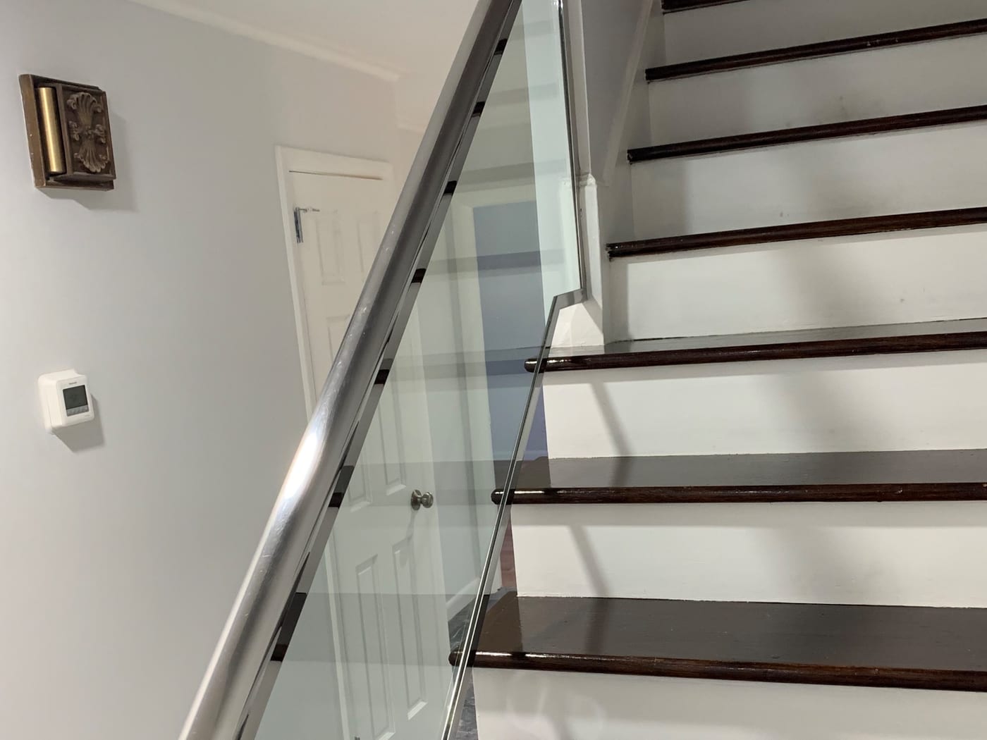 A herringbone hardwood floor cleaned and polished to a mirror shine by A1 Cleaning Solutions